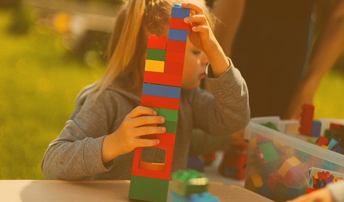 child playing with lego